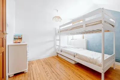 Un ou plusieurs lits dans un hébergement de l'établissement Maison Familiale 100m de la mer