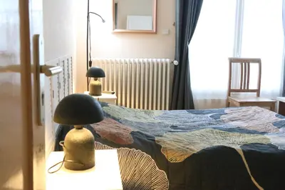 Un ou plusieurs lits dans un hébergement de l'établissement LES CHAMBRES de CATHERINE