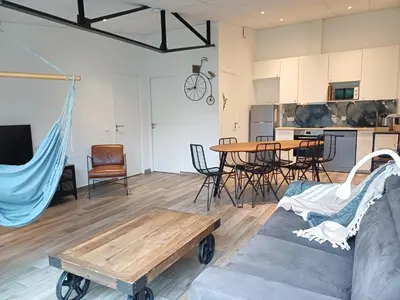 Coin salon dans l'établissement Ô 92 - Maison mitoyenne avec terrasse et parking privé - Saint-Lô centre