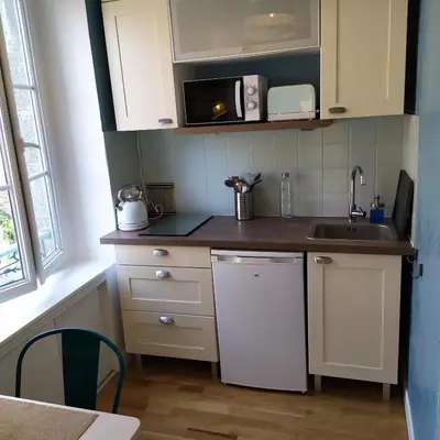 Cuisine ou kitchenette dans l'établissement Studio TERRASSE