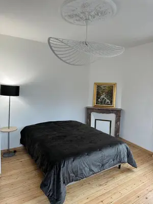 Un ou plusieurs lits dans un hébergement de l'établissement Villa Art Déco