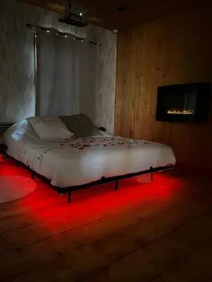 Un ou plusieurs lits dans un hébergement de l'établissement Ô Chalet Normand
