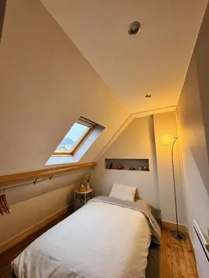 Un ou plusieurs lits dans un hébergement de l'établissement Charmante maison moderne et cosy