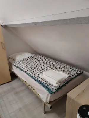 Un ou plusieurs lits dans un hébergement de l'établissement cottage au bord de mer