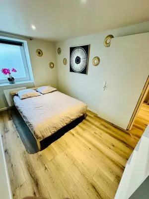 Un ou plusieurs lits dans un hébergement de l'établissement Appartement moderne et chaleureux