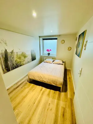 Un ou plusieurs lits dans un hébergement de l'établissement Appartement moderne et chaleureux