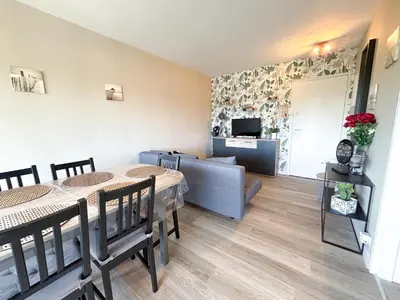Coin salon dans l'établissement Cabourg bel appartement proche de la plage