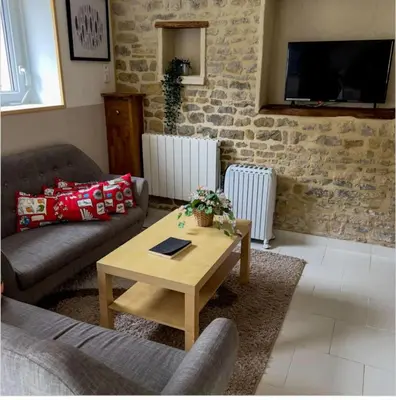 Télévision ou salle de divertissement dans l'établissement Gîte UTAH Confort et Découverte en Normandie