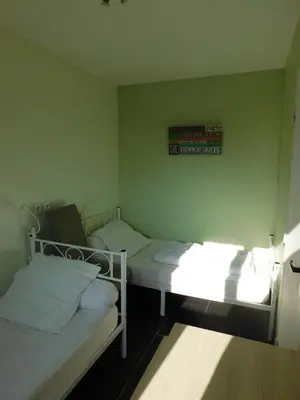 Un ou plusieurs lits dans un hébergement de l'établissement Bel appartement avec vue sur l'hippodrome