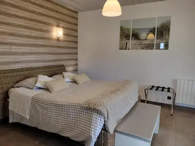 Un ou plusieurs lits dans un hébergement de l'établissement Studio Côté Jardin 2 personnes