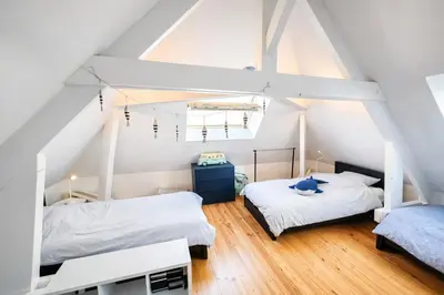 Un ou plusieurs lits dans un hébergement de l'établissement Maison face à la mer avec la Plage à 50 m & Parking privé
