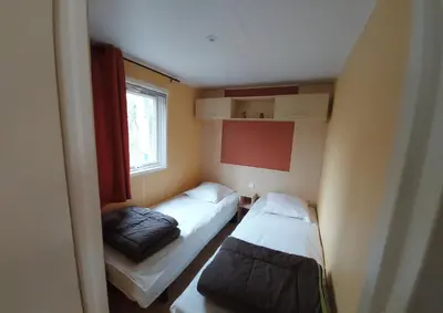 Un ou plusieurs lits dans un hébergement de l'établissement location mobile home proche de la mer