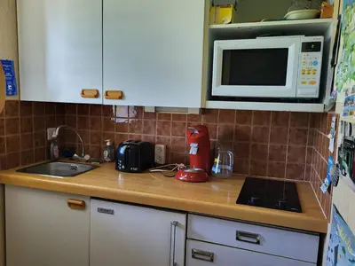 Cuisine ou kitchenette dans l'établissement Duplex cosy proche plage avec parking privatif - FR-1-788-100