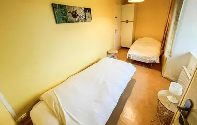 Un ou plusieurs lits dans un hébergement de l'établissement Gîte Le Maliverney
