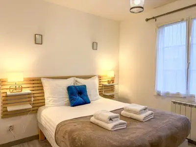 Un ou plusieurs lits dans un hébergement de l'établissement Le Petit Barfleur - Appartement T2 avec Jardin