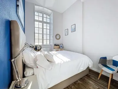 Un ou plusieurs lits dans un hébergement de l'établissement Appartement Cocon avec Wifi et Parking près Plage - FR-1-361-571
