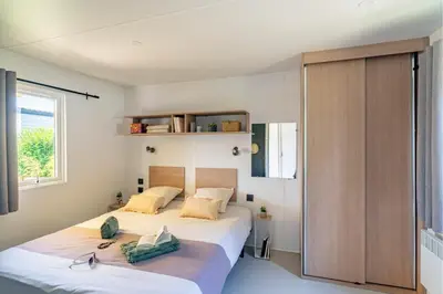 Un ou plusieurs lits dans un hébergement de l'établissement Cottage 4p 2Bdrms AirCon