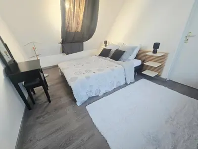 Un ou plusieurs lits dans un hébergement de l'établissement Maison en Normande