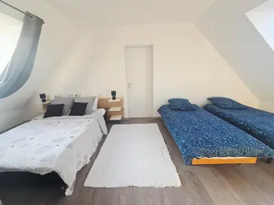 Un ou plusieurs lits dans un hébergement de l'établissement Maison en Normande