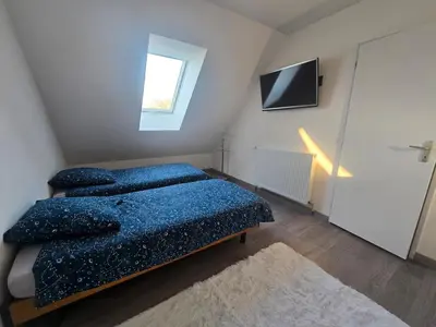Un ou plusieurs lits dans un hébergement de l'établissement Maison en Normande