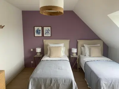 Un ou plusieurs lits dans un hébergement de l'établissement GITE BEAUSEJOUR à Fontenay sur Mer, 50m de la plage et face au golf