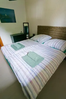 Un ou plusieurs lits dans un hébergement de l'établissement Modernes Landhaus mit großem Garten