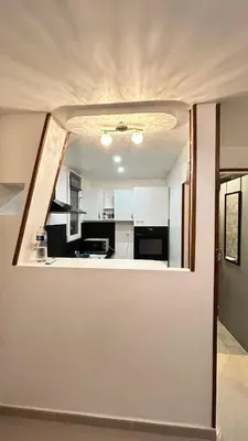 Cuisine ou kitchenette dans l'établissement Studio duplex Meublé