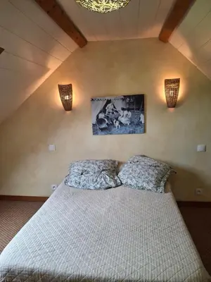Un ou plusieurs lits dans un hébergement de l'établissement CHAMBRES D'HOTES à LA FERME DES GOSSELINS