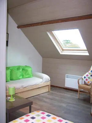 Un ou plusieurs lits dans un hébergement de l'établissement CHAMBRES D'HOTES à LA FERME DES GOSSELINS