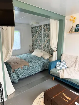 Un ou plusieurs lits dans un hébergement de l'établissement Le Petit Lodge