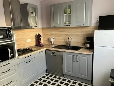 Cuisine ou kitchenette dans l'établissement maison individuelle, familiale et spacieuse