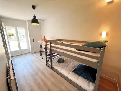 Un ou plusieurs lits dans un hébergement de l'établissement La brise au pied de la plage