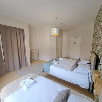 Un ou plusieurs lits dans un hébergement de l'établissement Eco Hôtel du Domaine de Ouézy
