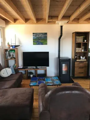 Coin salon dans l'établissement La flibustiere maison de pecheur calme et authentique