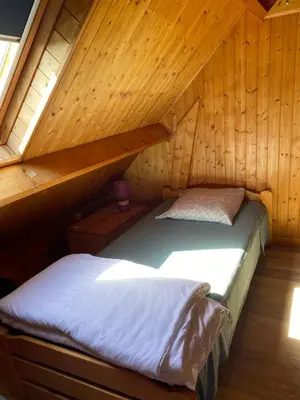 Un ou plusieurs lits dans un hébergement de l'établissement Petit chalet