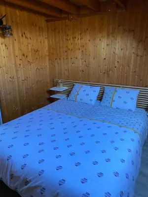Un ou plusieurs lits dans un hébergement de l'établissement Petit chalet