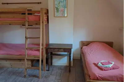 Un ou plusieurs lits dans un hébergement de l'établissement Maison de charme authentique avec piscine privée proche de Cabourg