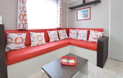 Coin salon dans l'établissement Mobile-Home Proche Mer 400M