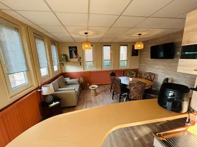Coin salon dans l'établissement Espace Familiale Meublé 3 chambres