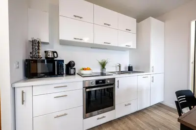 Cuisine ou kitchenette dans l'établissement Le Ptit Charmant - 1km de la Plage