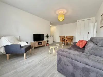 Coin salon dans l'établissement Appartement lumineux avec balcon