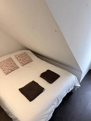 Un ou plusieurs lits dans un hébergement de l'établissement Granville appartement