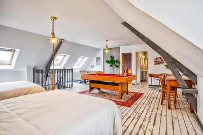 Un ou plusieurs lits dans un hébergement de l'établissement Maison de ville 12p - Plages du débarquement