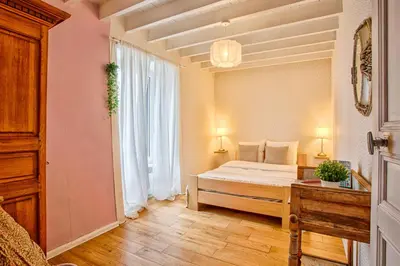 Un ou plusieurs lits dans un hébergement de l'établissement Maison de ville 12p - Plages du débarquement