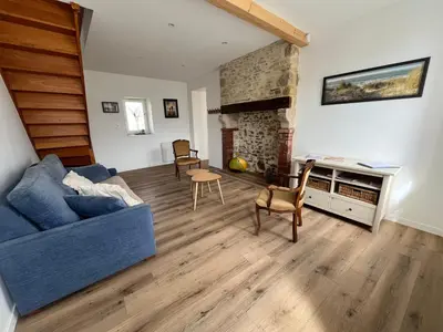 Coin salon dans l'établissement Au Boulevard des Dunes