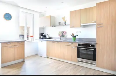 Cuisine ou kitchenette dans l'établissement Au Boulevard des Dunes