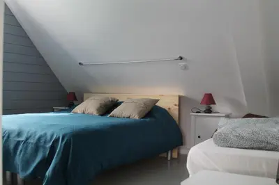 Un ou plusieurs lits dans un hébergement de l'établissement Maison Mama Neko