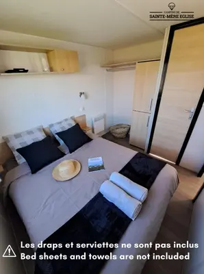 Un ou plusieurs lits dans un hébergement de l'établissement Camping Sainte Mère Eglise
