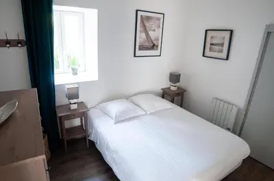 Un ou plusieurs lits dans un hébergement de l'établissement Gite Ferme d'Ervée de Saint-Roch