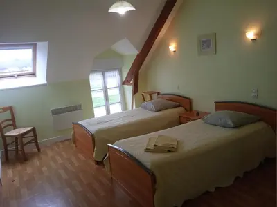 Un ou plusieurs lits dans un hébergement de l'établissement Chambres d'hôtes Le Petit Angle